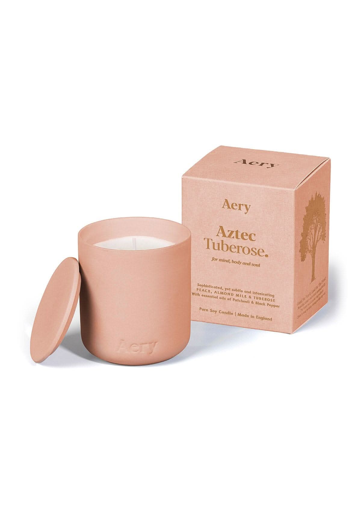 Peach Aztec Tuberose ceramic scented candle by Aery on white bacground