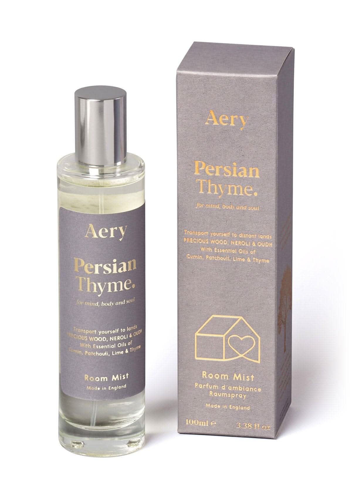 Grey Persian Thyme room mist displayed next to product packaging by Arey on white bacground