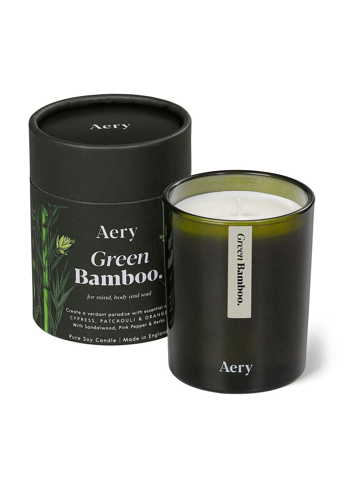 Green Bamboo candle by Aery displayed next to product packaging on white bacground