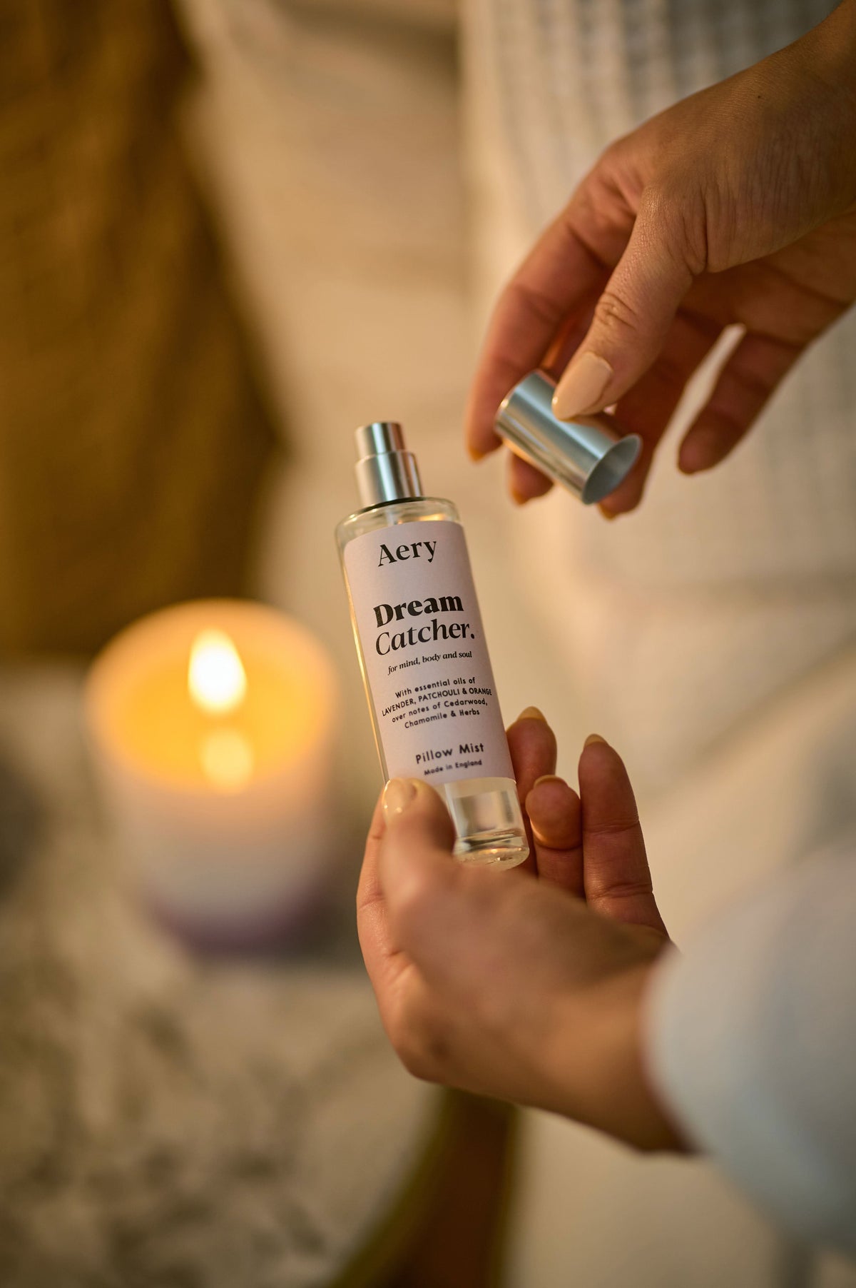 Lilac Dream Catcher Pillow Mist by Aery displayed in hands