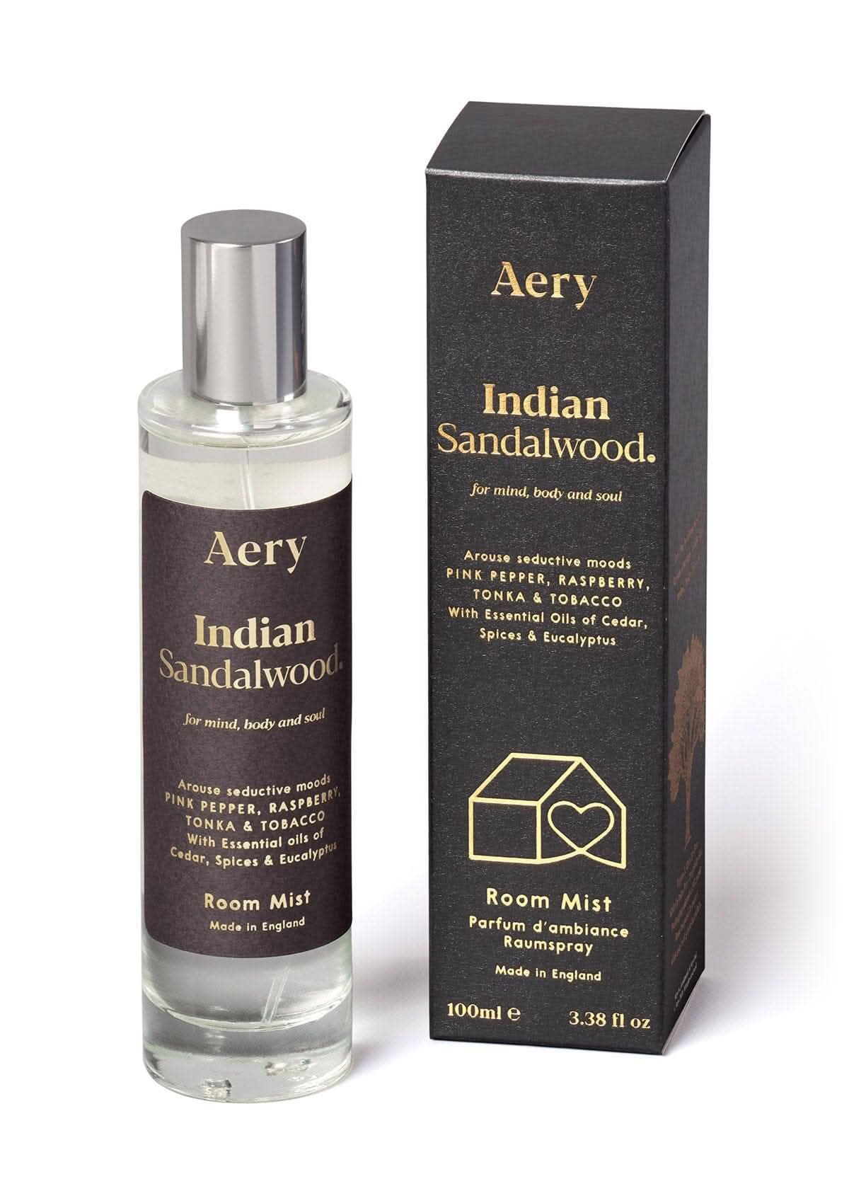 Black Indian Sandalwood room mist displayed next to product packaging by Aery on white bacground